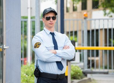 depositphotos_120485830-stock-photo-security-guard-standing-arm-crossed
